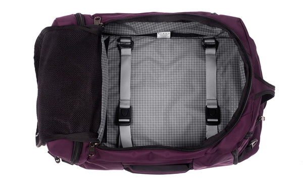 An open Techonaut 30 with an Aubergine (red-ish purple) exterior and a Northwest Sky (grey) interior.
